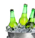 Metal bucket with bottles of beer and ice cubes isolated Royalty Free Stock Photo