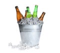 Metal bucket with bottles of beer and ice cubes isolated Royalty Free Stock Photo