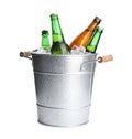 Metal bucket with bottles of beer and ice cubes isolated Royalty Free Stock Photo