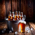 Metal bucket with cold bottles of beer and ice