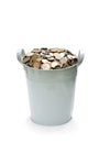 Metal bucket full of pound sterling coins isolated on white Royalty Free Stock Photo