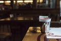 A metal bucket with a tip on the table in an Italian restaurant in a bucket a few notes and a check Royalty Free Stock Photo