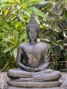 Metal buddha statue lotus pose .