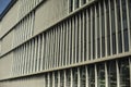 Metal building texture. Narrow windows in wall. Details of modern architecture