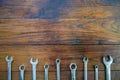 Metal bunch wrench  tools lying on dark wooden background Royalty Free Stock Photo