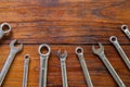 Metal bunch wrench  tools lying on dark wooden background Royalty Free Stock Photo