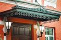 A metal canopy above the entrance with an ornament Royalty Free Stock Photo