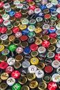 Metal caps from different drinks, from beer, soda, cola