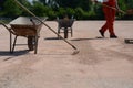 Metal cart with rakes on construction site