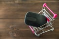 A metal cart from the supermarket with a computer mouse. The concept of shopping on the Internet Royalty Free Stock Photo