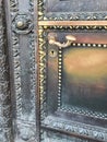 Metal carved historic door with vintage handle and keyhole. Closeup, vertical photo Royalty Free Stock Photo