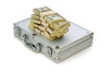 Metal case and lots of dollars Royalty Free Stock Photo