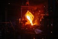 Metal casting process in metallurgical plant. Liquid metal pouring into molds