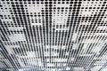 Metal ceiling. Perforated panels of suspended ceiling. Office building interior fragment.