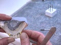 Metal-ceramic dental crown is tried on an gypsum model Royalty Free Stock Photo