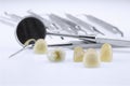 Metal ceramic dentures with dentist tools Royalty Free Stock Photo