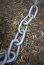 A metal chain on the ground Royalty Free Stock Photo