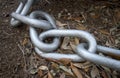 A metal chain on the ground Royalty Free Stock Photo