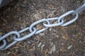 Metal chain on the ground Royalty Free Stock Photo