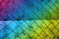metal chain link fence on dark grunge concrete wall texture Royalty Free Stock Photo