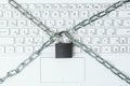 Metal chain and padlock on white laptop keyboard background Royalty Free Stock Photo