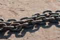 Metal steel chain on an old concrete pier Royalty Free Stock Photo