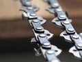 metal chainsaw chain with sharp teeth close-up