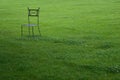 Metal chair in garden Royalty Free Stock Photo