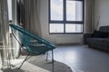 Metal chair, living room interior. modern armchair near panoramic windows. Panoramic windows. Template. Royalty Free Stock Photo