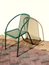Metal chair in the sun Royalty Free Stock Photo