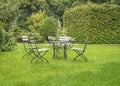 Metal chairs and a table in a public park Royalty Free Stock Photo