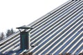 Metal chimney on copper roof - image with copy space