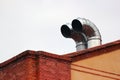 Metal chimneys on a roof Royalty Free Stock Photo