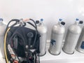 Metal chrome aluminum gas cylinders for breathing underwater, diving with valves, reducers and a black suit for diving with hoses