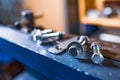 Metal chrome bolts and nuts on manual flexible massive machine