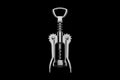 Metal chrome corkscrew for wine corks on a black Royalty Free Stock Photo