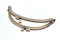 The metal clasp for leather or textile purses, handbags, wallets