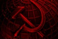 Metal coat of arms of USSR with hammer and sickle on background of globe of earth. Symbol of communism and socialism.