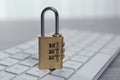 Metal code padlock and computer keyboard on table, closeup. Cyber security concept Royalty Free Stock Photo