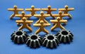 Metal cogs cogwheels and wooden figures of people Royalty Free Stock Photo