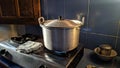 Metal colored cooking pan with boiling water on a stove Royalty Free Stock Photo