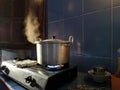 Metal colored cooking pan with boiling water on a stove Royalty Free Stock Photo