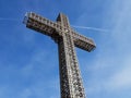 Metal construction christian cross with beautiful blue sky background.