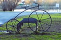 Metal construction in the form of a bicycle and parallel pipes for parking of personal bikes and scooters. Royalty Free Stock Photo