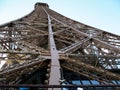 Metal construction. Fragment of the Eiffel Tower in Paris, France. Bottom view. Unusual angle of photography
