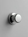 Metal Control Knob Mounted on a Plain Wall Ready for Adjustment in Modern Interior Design Space Royalty Free Stock Photo