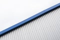 Metal corrugated sheets on a building with a blue metal corners. White aluminium metal corrugated roof or wall sheets Royalty Free Stock Photo