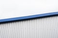 Metal corrugated sheets on a building with a blue metal corners. White aluminium metal corrugated roof or wall sheets Royalty Free Stock Photo