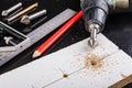 Metal countersink for making holes for screws. Minor jobs in the carpentry workshop Royalty Free Stock Photo