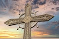 Metal cross against dramatic sky. Kamianets-Podilskyi, Ukraine Royalty Free Stock Photo